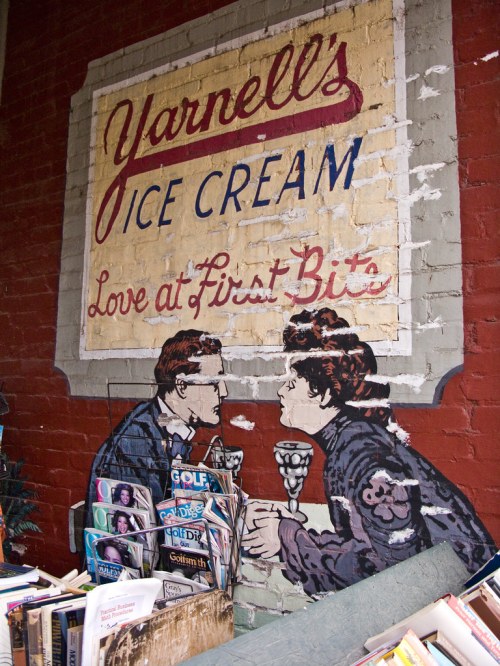 Vintage mural of a couple enjoying ice cream, with the text "Yarnell's Ice Cream - Love at First Bites" above.