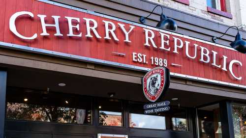 Sign for Cherry Republic, established in 1989, featuring a logo and details about wine tasting.