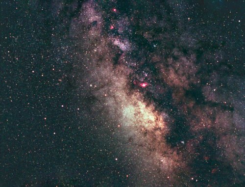 A stunning view of the galaxy, showcasing vibrant colors, stars, and cosmic dust against a dark background.