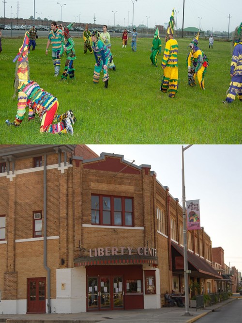 Colorful figures in costumes perform in a grassy field; below, a brick building with a sign reading "Liberty Center."