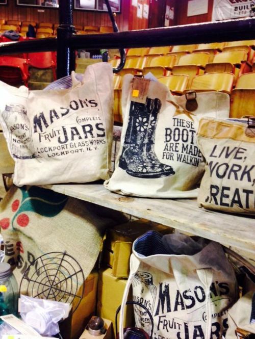 A collection of vintage bags with text, including "Mason's Fruit Jars" and "These boots are made for walking."