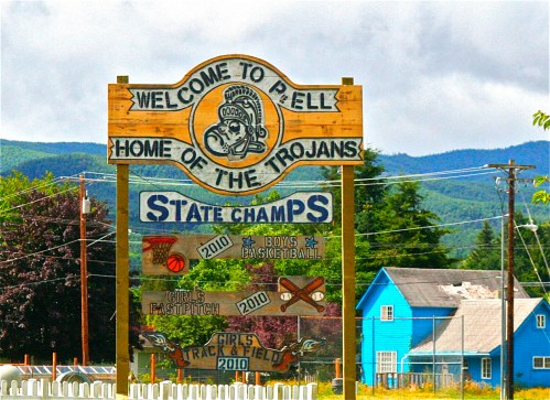 Welcome sign for Pell, home of the Trojans, featuring state championship achievements in various sports.