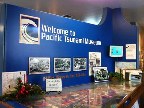 Signage and displays at the Pacific Tsunami Museum, featuring historical photos and information about Hilo Town in 1946.