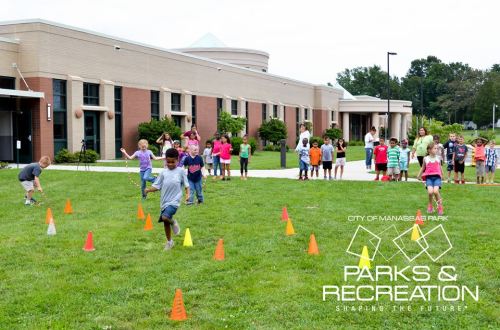 Children participate in outdoor activities, navigating cones on a grassy field, with a building in the background.