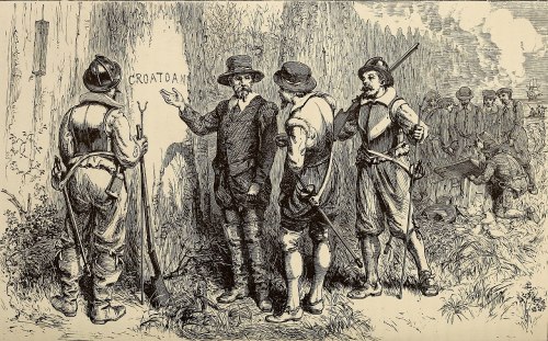 Colonial figures discussing the "CROATOAN" inscription on a tree, with others working in the background.