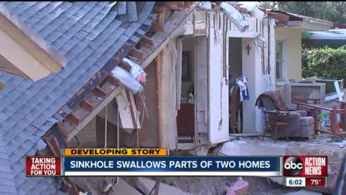 A sinkhole has damaged parts of two homes, exposing interiors and structural damage. News banner at the bottom.