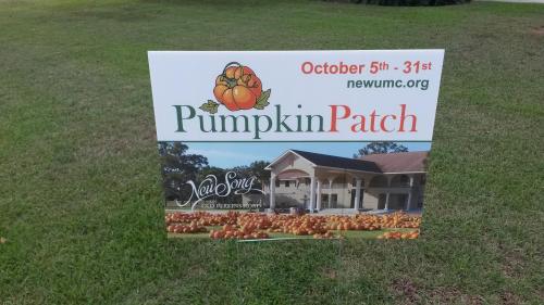 Sign for a pumpkin patch event, featuring pumpkins and details about dates and the hosting organization.