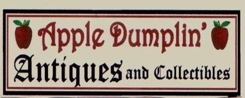 Sign for "Apple Dumplin' Antiques and Collectibles" featuring red apples and decorative text.