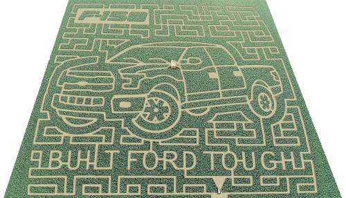 A corn maze design featuring a Ford F-150 truck with the phrase "Built Ford Tough" integrated into the pattern.