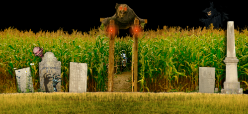 A spooky scene with a cornfield, a bear on a gate, and eerie gravestones under a dark sky.