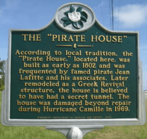 Historical marker for the "Pirate House," detailing its history and connection to pirate Jean Lafitte.