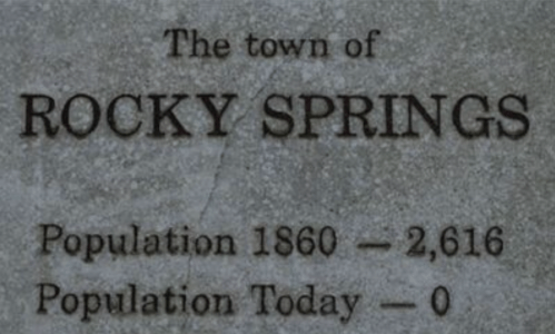 Sign for Rocky Springs, noting a population of 2,616 in 1860 and a current population of 0.