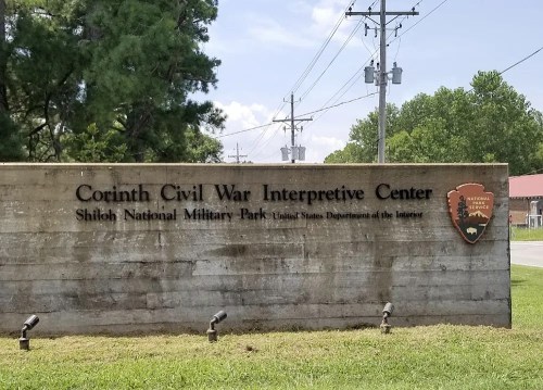 Sign for the Corinth Civil War Interpretive Center at Shiloh National Military Park, featuring the National Park Service logo.