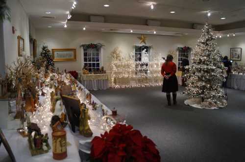 A festive room decorated for the holidays, featuring a Christmas tree, lights, and various holiday displays.