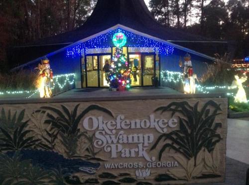 Entrance to Okefenokee Swamp Park, decorated with holiday lights and a Christmas tree, Waycross, Georgia.