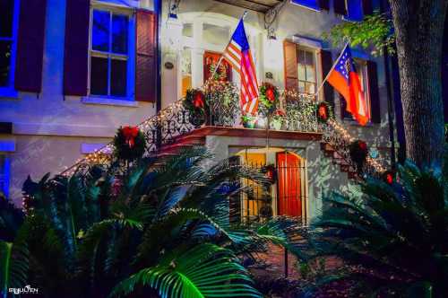 A festive building adorned with holiday decorations, featuring American and Georgia flags, surrounded by lush greenery.