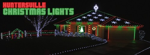 A house decorated with colorful Christmas lights, featuring green and red designs, snowflakes, and a festive atmosphere.