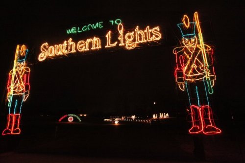 Colorful holiday lights display featuring a sign that reads "Welcome to Southern Lights" with toy soldier figures.