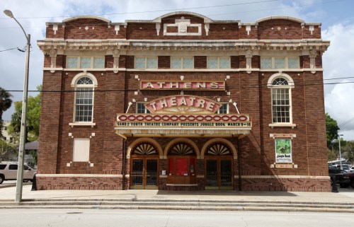Historic Athens Theatre building with a marquee announcing a youth production of "Jungle Book."
