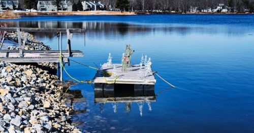 Dock in Maine with Christmas decorations and lights on it