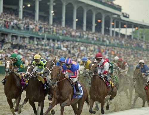 A thrilling horse race with jockeys in colorful silks, surrounded by a cheering crowd at a racetrack.