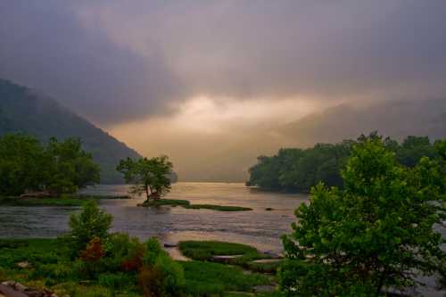 A serene river scene at dawn, surrounded by misty mountains and lush greenery, with soft light reflecting on the water.