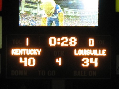 Scoreboard showing Kentucky 40, Louisville 34 with 28 seconds left in the fourth quarter of a football game.