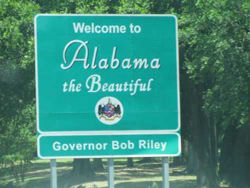 Welcome sign for Alabama, featuring the phrase "Alabama the Beautiful" and the name of Governor Bob Riley.