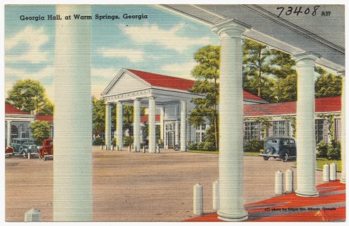 Vintage postcard of Georgia Hall at Warm Springs, Georgia, featuring columns, a red roof, and classic cars.