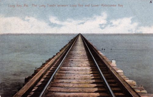 A long railway trestle stretches over calm water, connecting Long Key and Lower Matecumbe Key in Florida.