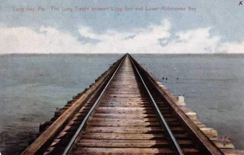 A long railway trestle stretches over calm water, connecting Long Key and Lower Matecumbe Key in Florida.