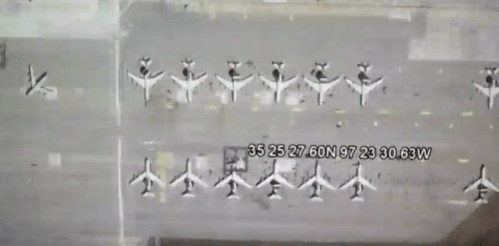 Aerial view of an airport runway with multiple airplanes lined up, along with GPS coordinates displayed.
