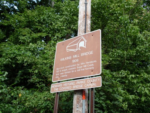 Sign for Wilkins Mill Bridge, built in 1906, located in Indiana's Park County, known for its covered bridges.