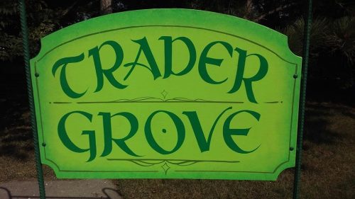 Green sign with the text "TRADER GROVE" in decorative lettering.