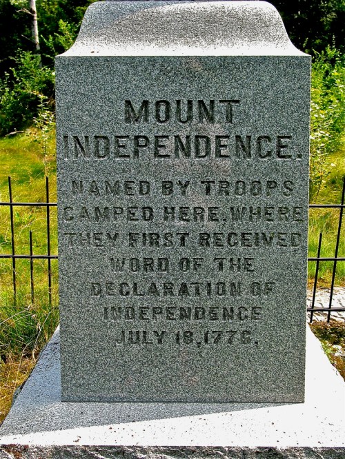 A stone monument inscribed with "Mount Independence," detailing its historical significance from July 18, 1776.