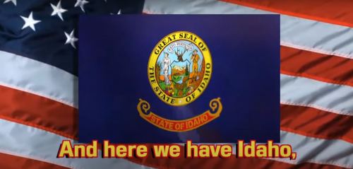 Image of the Idaho state seal on a blue background, with an American flag in the background and text reading "And here we have Idaho."
