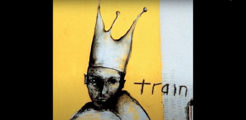 A stylized figure wearing a crown against a yellow background, with the word "train" partially visible.