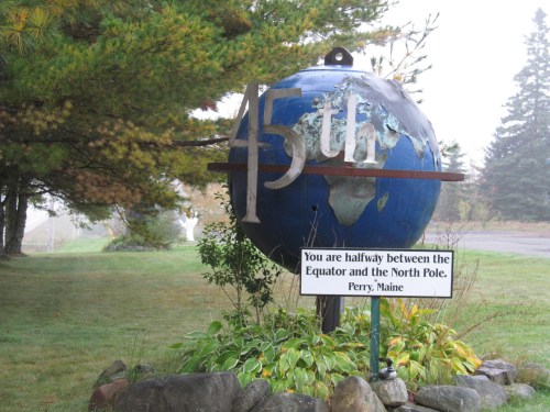 A globe marker indicating the 45th parallel, halfway between the Equator and the North Pole, in Perry, Maine.