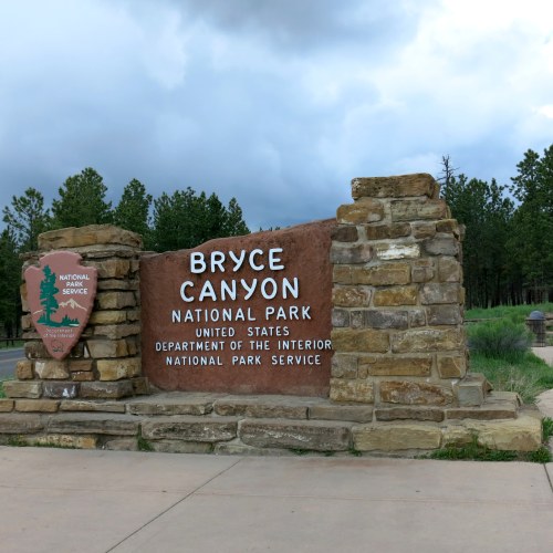 Sign for Bryce Canyon National Park, featuring the park's logo and information about the National Park Service.
