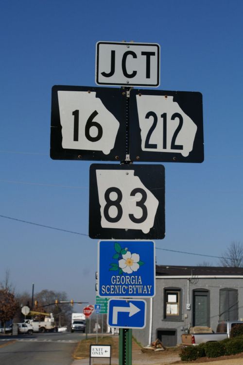 Road sign indicating junction of highways 16, 212, and 83, with a Georgia Scenic Byway marker below.