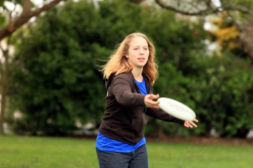 Female throwing frisbee