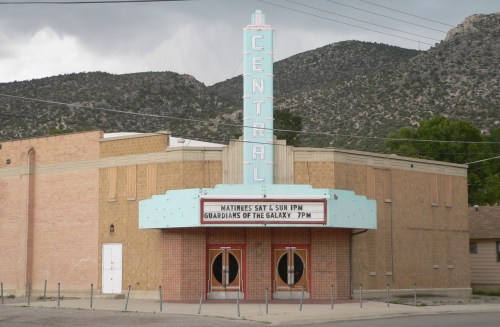 A vintage theater with a marquee displaying "Guardians of the Galaxy" and a retro sign reading "CENTRAL."