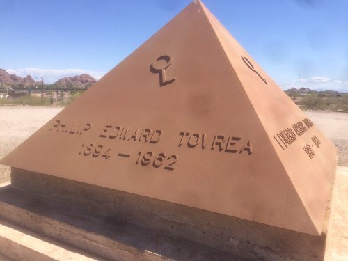 A pyramid-shaped monument with the name "Philip Edilard Toirea" and dates "1894-1962" engraved on it.