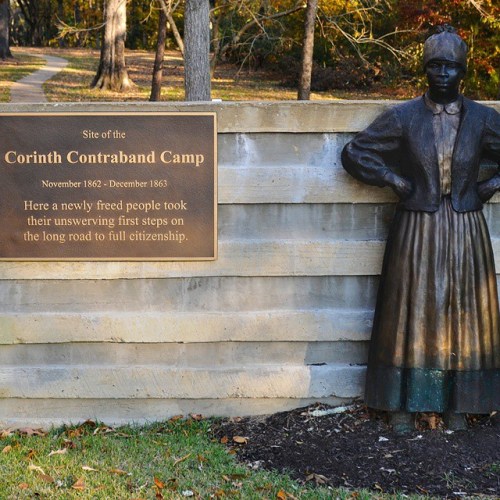 Statue commemorating the Corinth Contraband Camp, highlighting the journey to citizenship for formerly enslaved individuals.