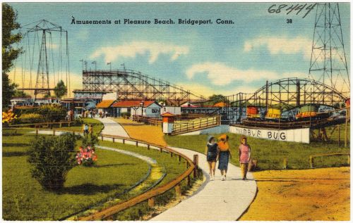Vintage postcard of Pleasure Beach amusement park in Bridgeport, Connecticut, featuring rides and a scenic pathway.
