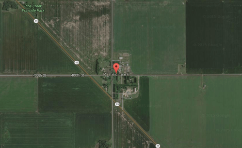 Aerial view of Pine Creek area, featuring fields and roads, with a marker indicating the location of Pine Creek.