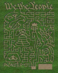 A maze design featuring symbols of American history, including the Liberty Bell and Statue of Liberty, with "We the People."