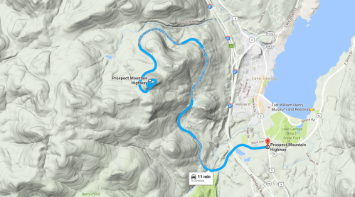 Map showing the winding route of Prospect Mountain Highway near Lake George, with surrounding terrain details.