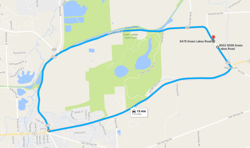 Map showing a route from one location to another, highlighting Green Lakes Road with a travel time of 15 minutes.