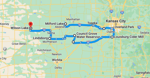 Map showing a route through Kansas, highlighting locations like Wilson Lake, Milford Lake, and Kansas City.